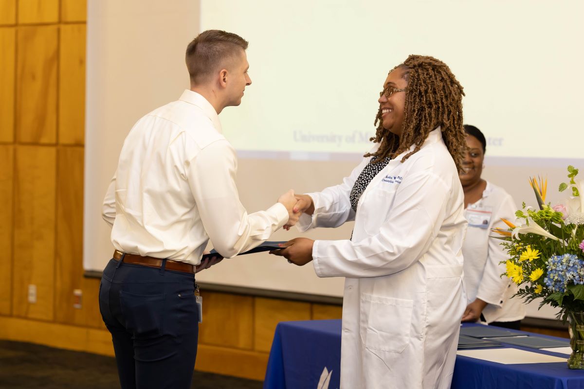 Student accepting an award at the 2023 Honors and Awards Ceremony